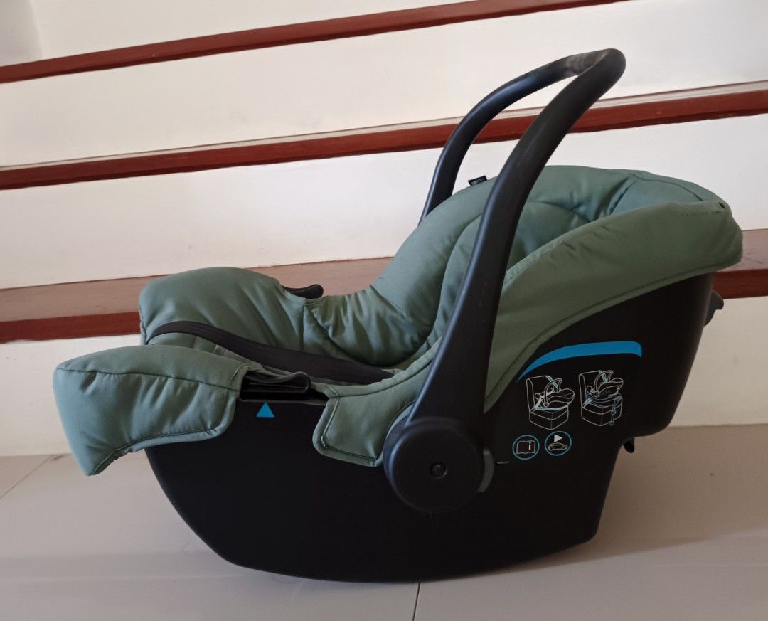 Joie Infant car seat carrier (Category: Car Seats) located in Makati City. Submitted by ayekai (Listing ID 1471207548, Image 2). Description: - Authentic Joie infant car seat in stylish olive green - Secure 5-point harness system with comfortable shoulder pads - Includes a soft newborn insert pillow for extra comfort - Curved bottom base allows smooth rocking when placed on the floor - Adjustable carry handle for easy transport - Side impact prot