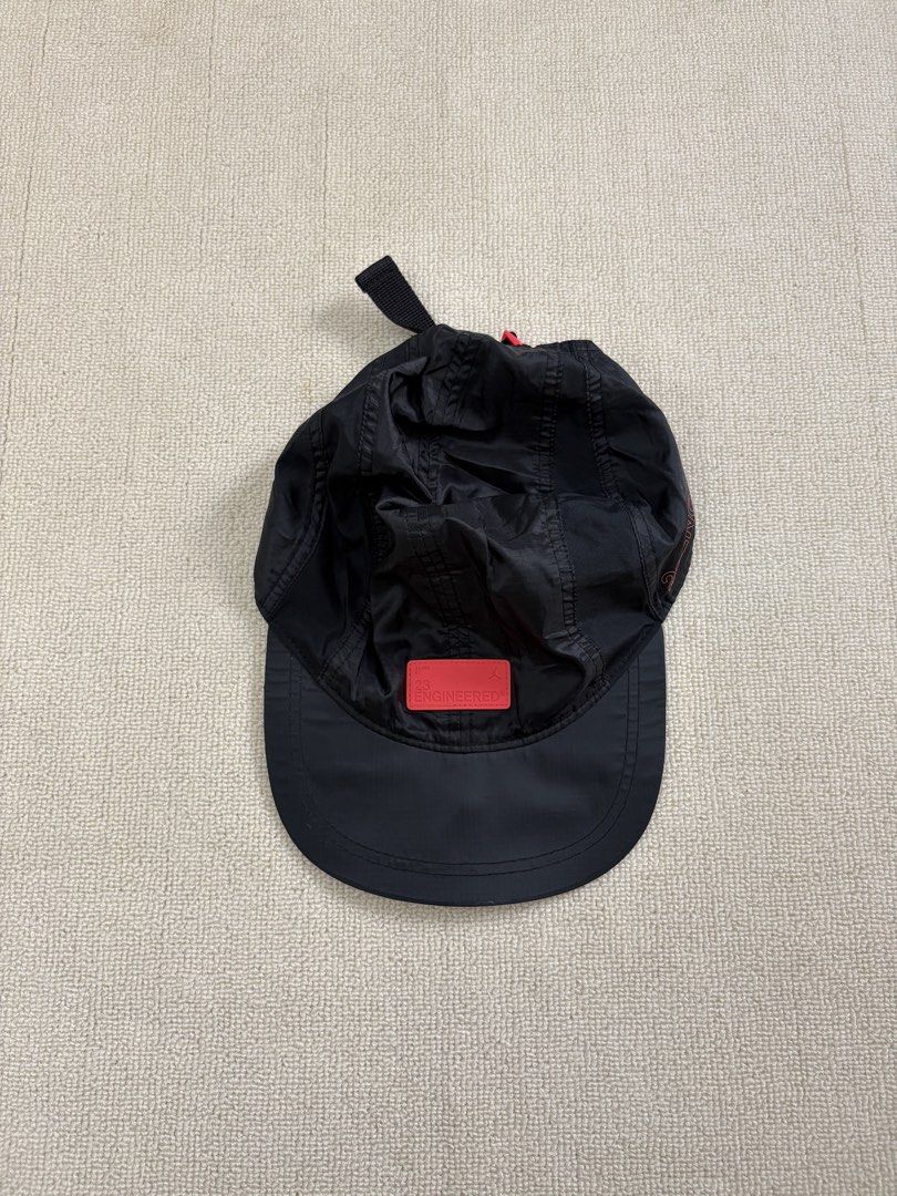 Jordan 23 Engineered Black Cap Hat (Category: Caps & Hats) located in Manila. Submitted by porma.market (Listing ID 1471272557, Image 2). Description: - Authentic Jordan 23 Engineered cap in versatile black - Eye-catching red rubber front logo patch and side text detailing - Adjustable back strap equipped with a secure red buckle - Made from 100% lightweight and durable polyester - Impeccable, clean condition inside and out - Perfect everyday acc