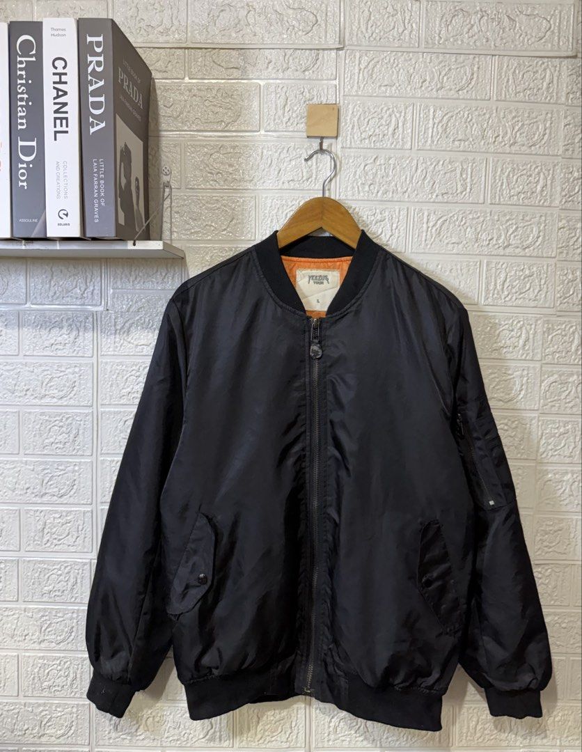 KANYE WEST YEEZUS TOUR MA-1 BOMBER JACKET (Category: Coats, Jackets and Outerwear) located in Baguio. Submitted by kds_stuffs (Listing ID 1471155286, Image 1). Description: Mine: 300 📍KANY3 W3ST "Y33ZUS TOUR" MA-1 bomber jacket 😍 Size: Large Dimension: 27L x 22W Color rate: 9/10 Issue: sinulatan nung gumamit ng marker, ituloy nyo nalang 😁😅 Very good condition Need wash Gandara neto 💗.