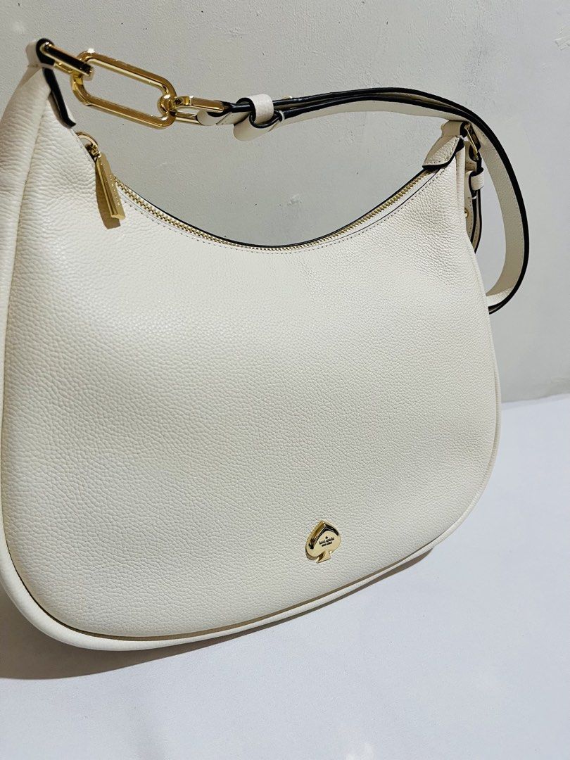 Kate Spade Kayla Large Shoulder Bag (Category: Luxury Bags & Wallets) located in Marikina City. Submitted by cafeenplus (Listing ID 1471126337, Image 2). Description: ✨ FOR SALE: KATE SPADE KAYLA LARGE SHOULDER BAG – WHITE 🤍👜 Classy, elegant, and timeless! 🤍 Perfect for everyday use or when you want to elevate your outfit. Can also be worn as a sling bag for a versatile look! ✨ Details: • Brand: Kate Spade • Model: Kayla Large Shoulder Bag • C