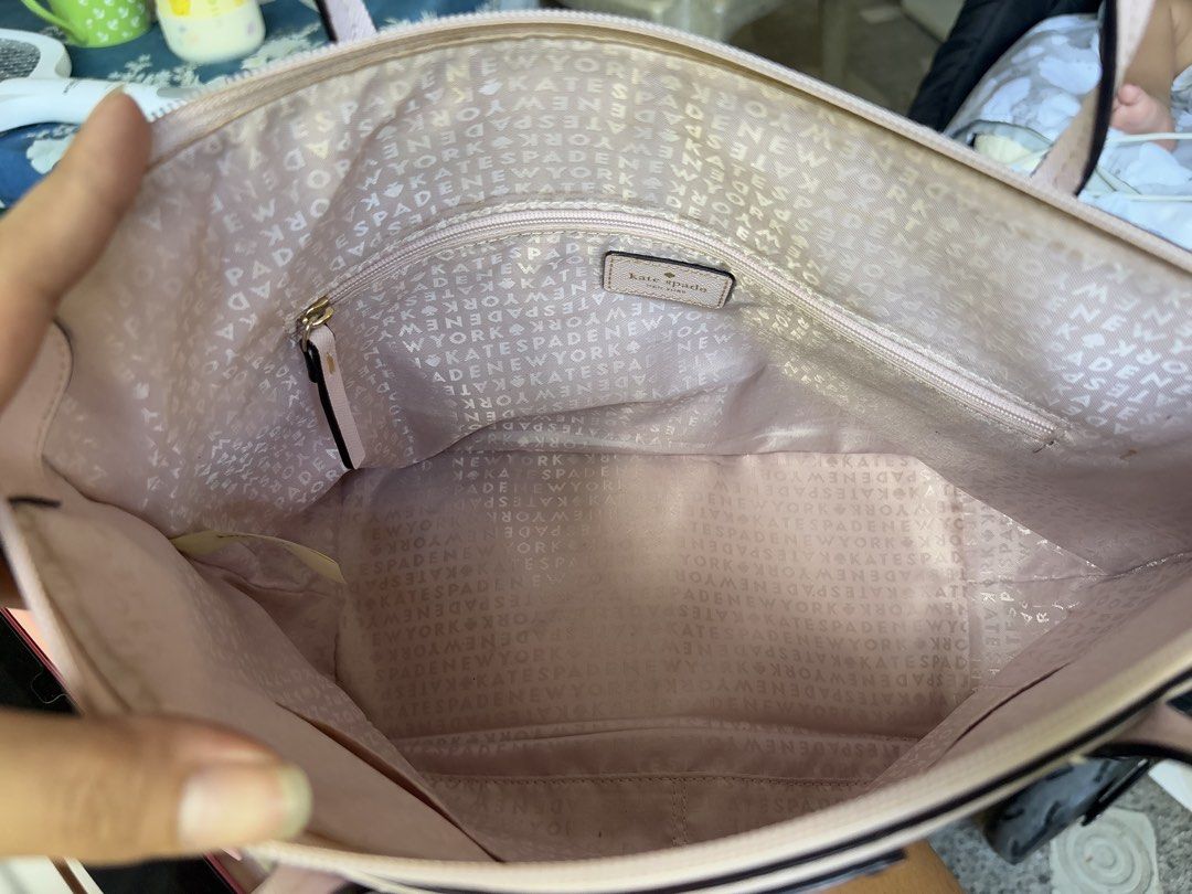 Kate Spade Pink Polka Dot Tote Bag (Category: Tote Bags) located in Manila. Submitted by dorilorenr48954 (Listing ID 1471227373, Image 2). Description: - Brand: Kate Spade - Color: Light pink with metallic gold polka dots - Closure: Zip top - Straps: Dual shoulder straps - Interior: Signature fabric lining with 1 zippered compartment and slip pockets - Flaws: Visible wear and fraying on the shoulder strap edges, plus minor peeling and scuffing al