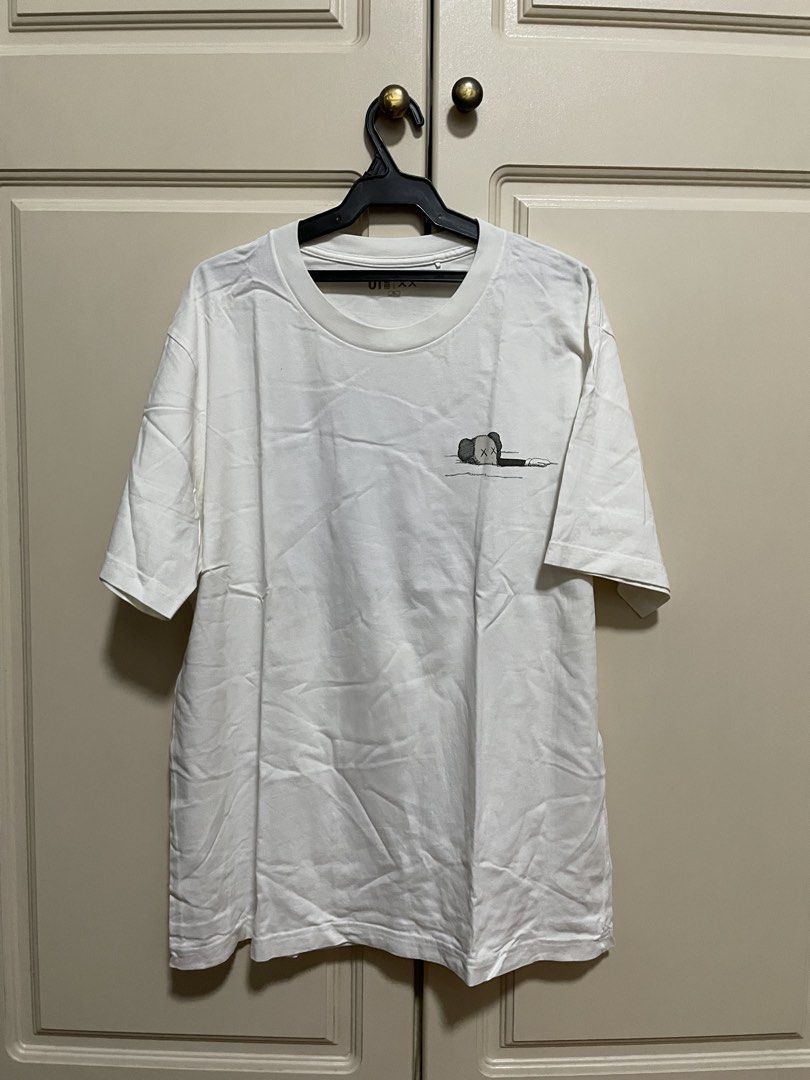 Kaws x Uniqlo graphic tee white/blue (Category: Tshirts & Polo Shirts ) located in Makati City. Submitted by crisbeooo (Listing ID 1471282520, Image 1). Description: Size XL Used for a few times, no issues.