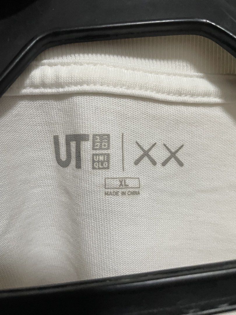 Kaws x Uniqlo graphic tee white/blue (Category: Tshirts & Polo Shirts ) located in Makati City. Submitted by crisbeooo (Listing ID 1471282520, Image 3). Description: Size XL Used for a few times, no issues.