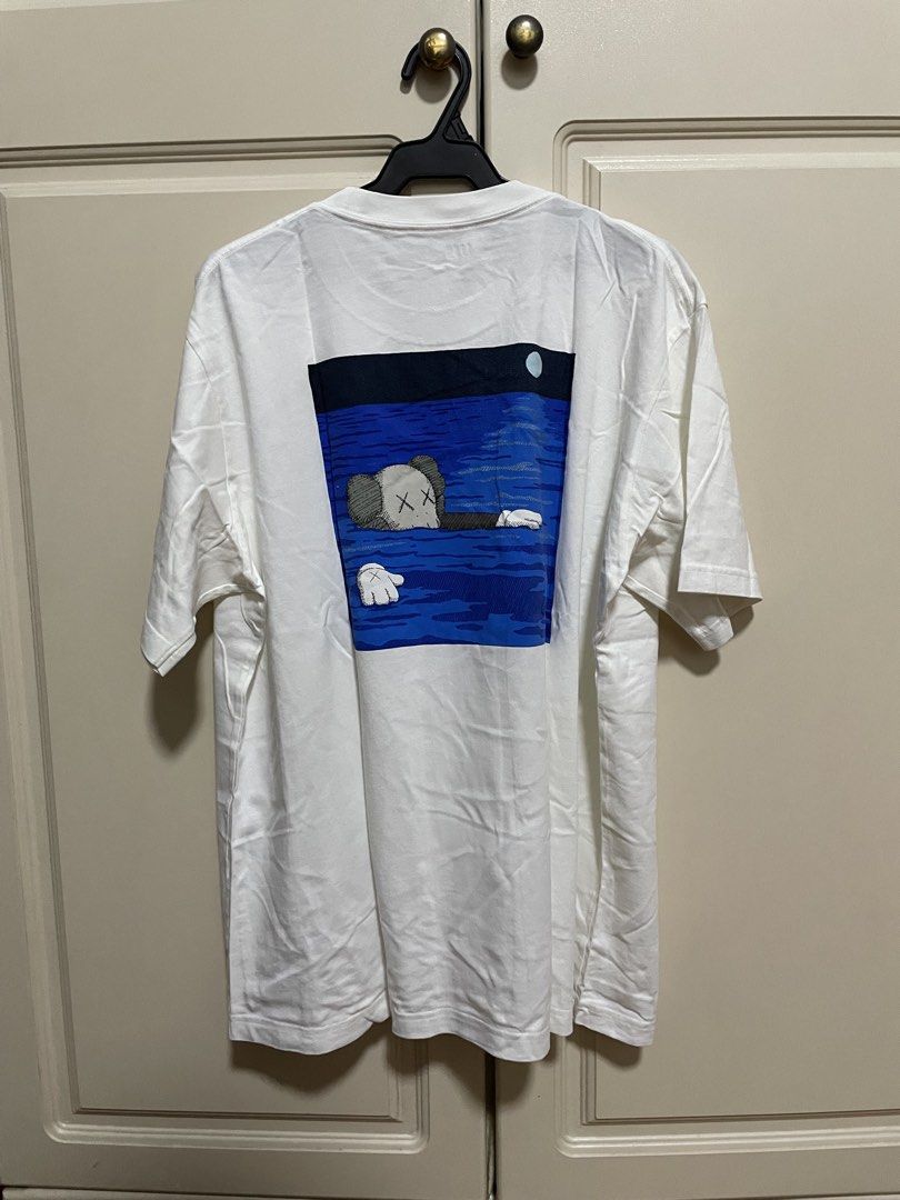 Kaws x Uniqlo graphic tee white/blue (Category: Tshirts & Polo Shirts ) located in Makati City. Submitted by crisbeooo (Listing ID 1471282520, Image 2). Description: Size XL Used for a few times, no issues.