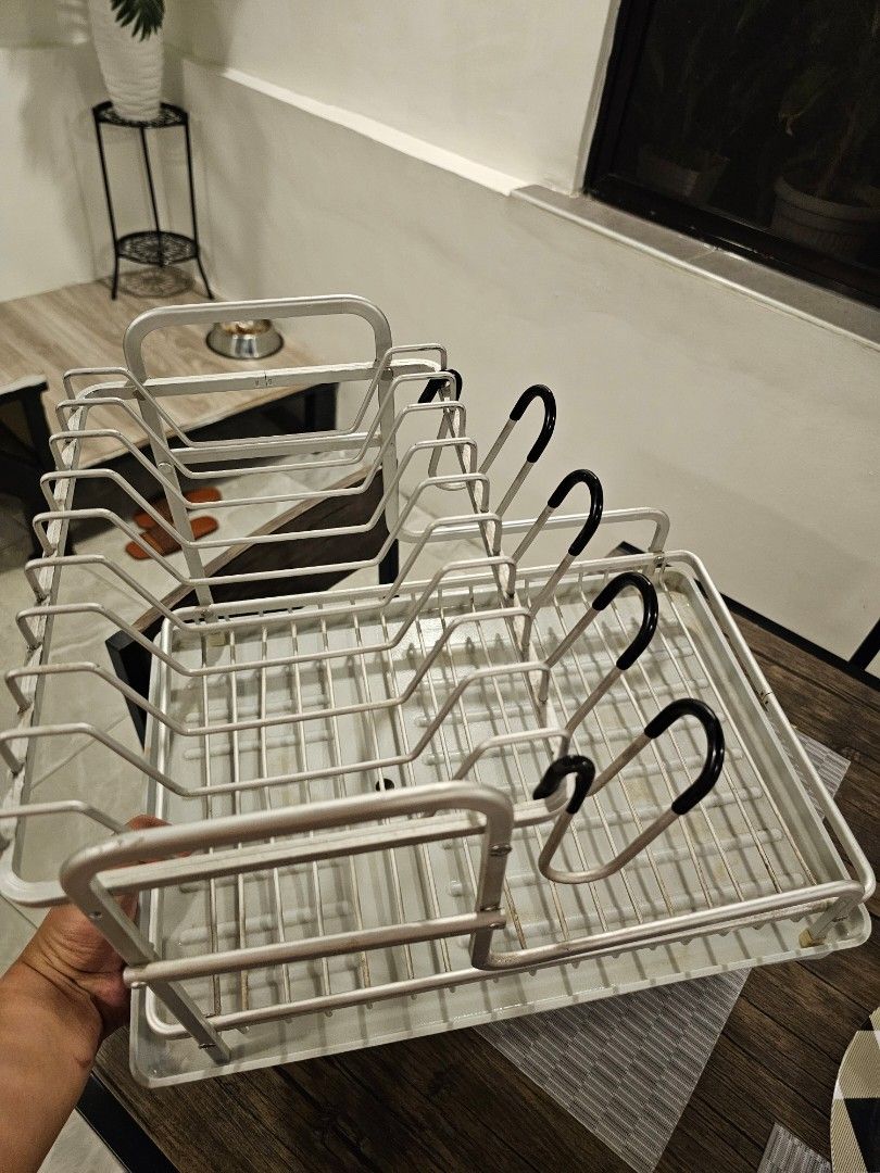 Kitchen Dish Drying Rack with Tray and Utensil Holder (Category: Food Organization & Storage) located in Makati City. Submitted by richpaul_ (Listing ID 1471258037, Image 2). Description: - Durable wire construction built to last - Includes grey plastic draining tray to keep counters dry - Dedicated slots for plates, bowls, and mugs - Convenient side compartment for cutlery and utensils - Compact size, perfect for placing right next to the sink P