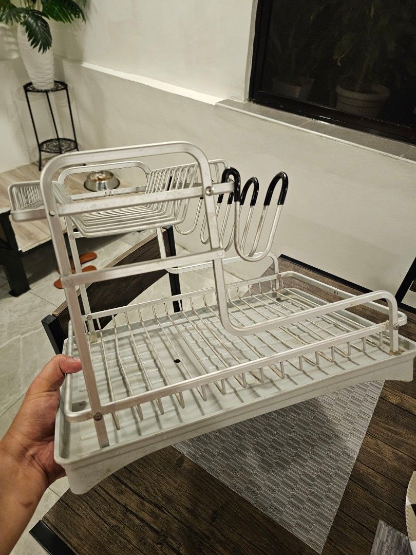 Kitchen Dish Drying Rack with Tray and Utensil Holder (Category: Food Organization & Storage) located in Makati City. Submitted by richpaul_ (Listing ID 1471258037, Image 3). Description: - Durable wire construction built to last - Includes grey plastic draining tray to keep counters dry - Dedicated slots for plates, bowls, and mugs - Convenient side compartment for cutlery and utensils - Compact size, perfect for placing right next to the sink P