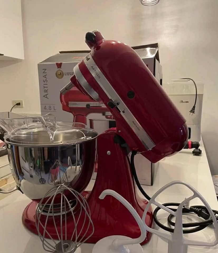 KitchenAid Artisan 4.8L Stand Mixer Empire Red (Category: Hand & Stand Mixers) located in Quezon City. Submitted by abarrijennylou155 (Listing ID 1471131529, Image 2). Description: - Iconic KitchenAid Artisan Stand Mixer in a stunning bold red finish - Includes stainless steel bowl with a comfortable handle - Comes complete with wire whip, dough hook, flat beater, and pouring shield - Original box included - Powerful motor featuring multiple spee