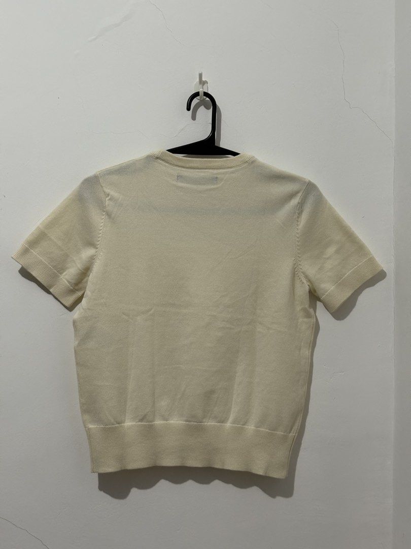Knitted Tops with mendings (Category: Blouses) located in Manila. Submitted by coolphoenix_f1e702 (Listing ID 1471226856, Image 2). Description: - Brand: MO Essentials - Size: M - Color: Cream - Style: Short sleeve knit top with round neckline, ribbed hem, and cuffs - Condition: Excellent, clean with no flaws - Versatility: Perfect for layering or wearing solo Knitted Overruns with mendings .