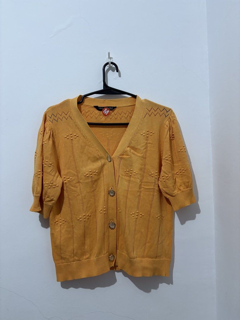 Knitted Tops with mendings (Category: Blouses) located in Manila. Submitted by coolphoenix_f1e702 (Listing ID 1471226856, Image 3). Description: - Brand: MO Essentials - Size: M - Color: Cream - Style: Short sleeve knit top with round neckline, ribbed hem, and cuffs - Condition: Excellent, clean with no flaws - Versatility: Perfect for layering or wearing solo Knitted Overruns with mendings .