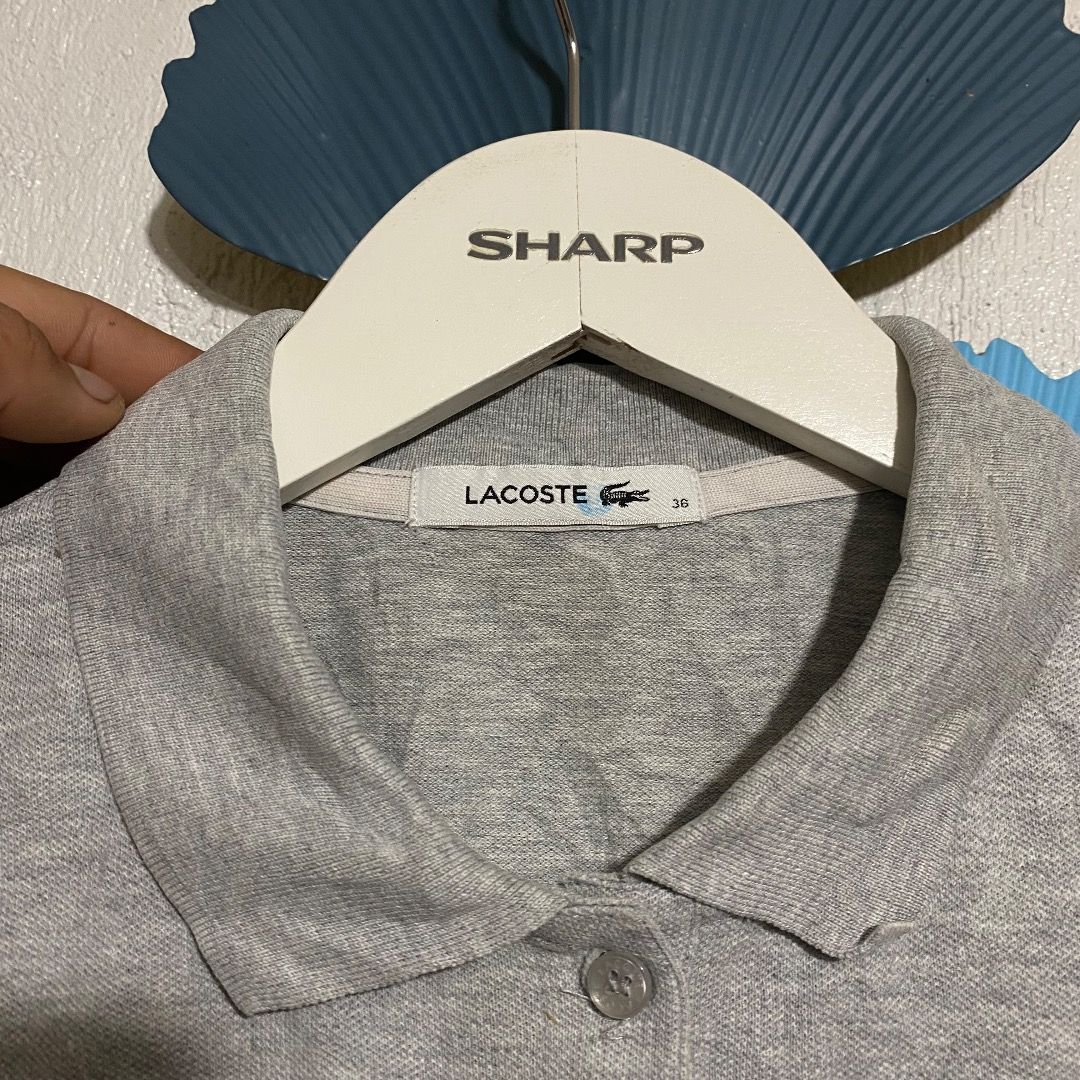 Lacoste Grey Polo Shirt (Category: Others Tops) located in Bacolod City. Submitted by jeybe112019 (Listing ID 1471272086, Image 2). Description: - Brand: Lacoste - Color: Grey - Material: Comfortable cotton blend - Size: Tag size 36 - Design: Short sleeves, classic collar, button placket - Detail: Iconic embroidered crocodile logo on the chest - Condition: Excellent pre-loved condition (ready to wear) - Mode of Payment: GCash, BPI, or Bank Transf