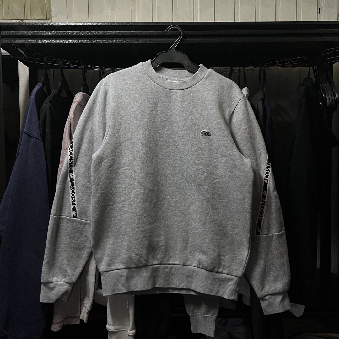 Lacoste Long Sleeve Crewneck Sweater Gray (Category: Coats, Jackets and Outerwear) located in Muntinlupa City. Submitted by ninenine.collective (Listing ID 1471123375, Image 1). Description: Lacoste Long Sleeve Crewneck Sweater Gray - 21/26.