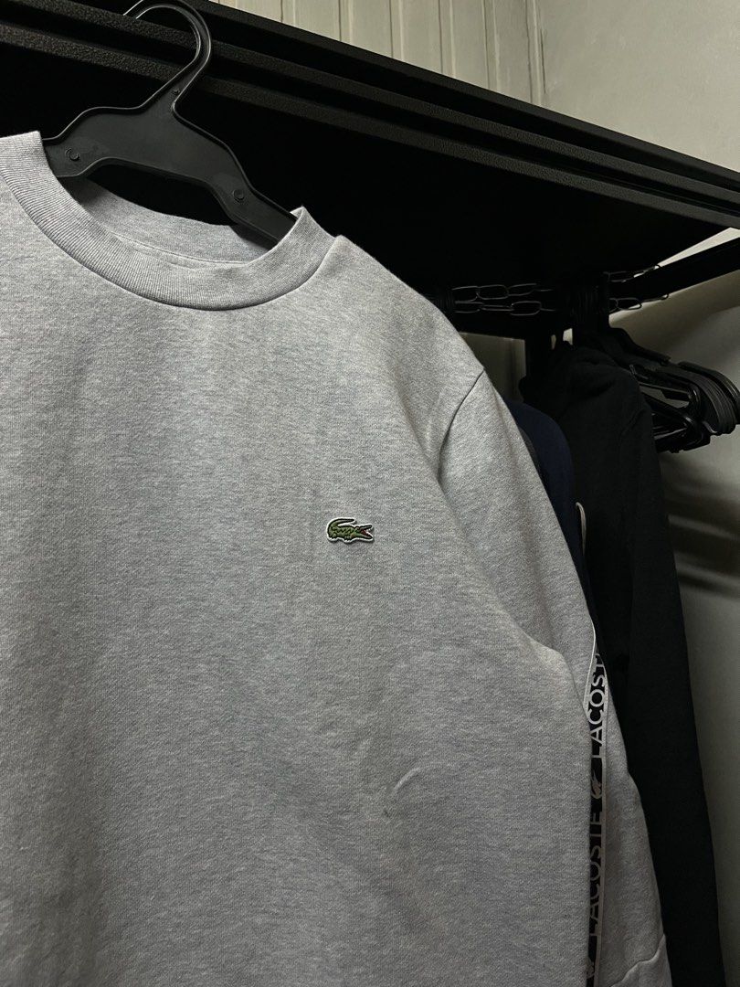 Lacoste Long Sleeve Crewneck Sweater Gray (Category: Coats, Jackets and Outerwear) located in Muntinlupa City. Submitted by ninenine.collective (Listing ID 1471123375, Image 2). Description: Lacoste Long Sleeve Crewneck Sweater Gray - 21/26.