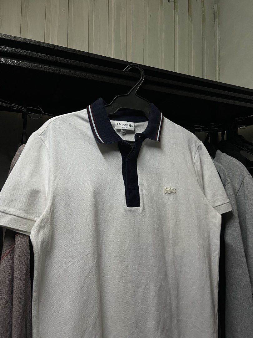 Lacoste Polo Shirt White Navy Collar (Category: Tshirts & Polo Shirts ) located in Muntinlupa City. Submitted by ninenine.collective (Listing ID 1471122824, Image 2). Description: Lacoste Polo Shirt White Navy Collar - 19.5/25.