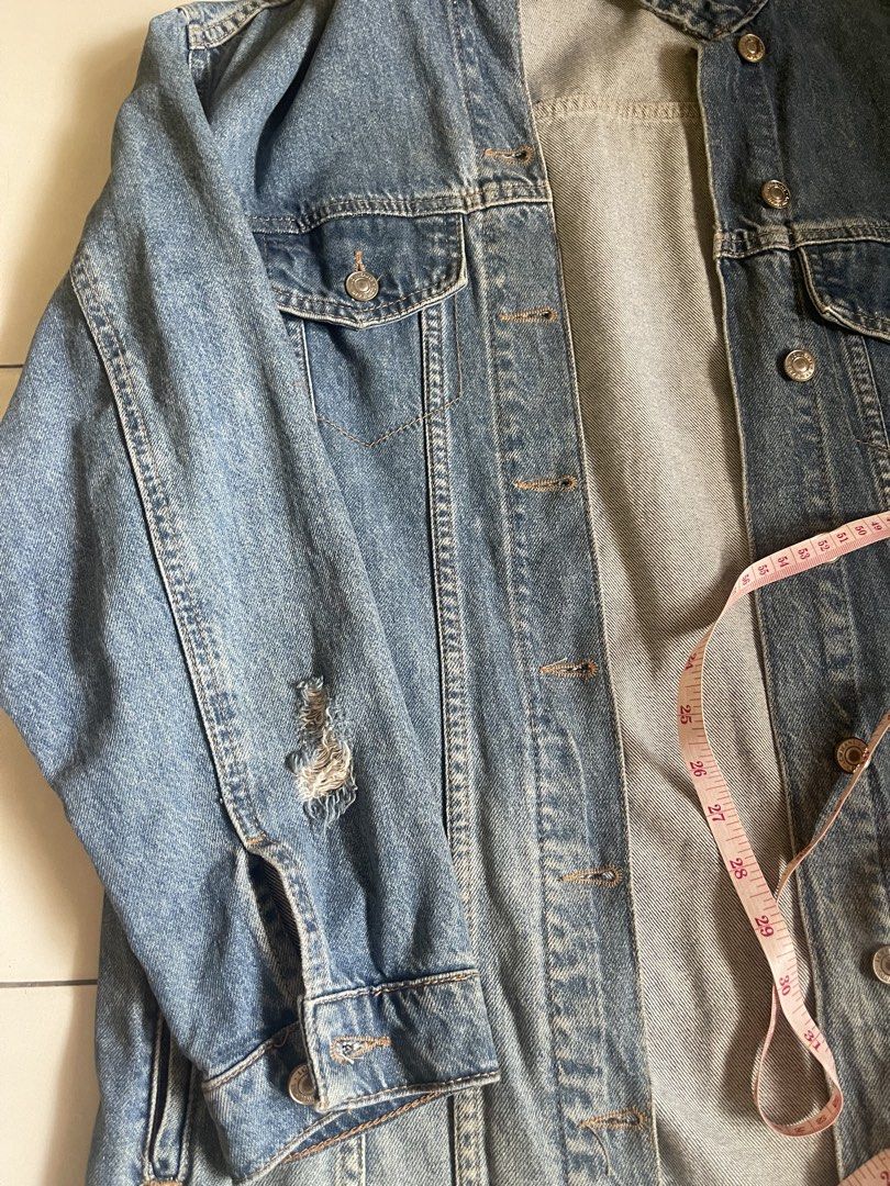 LCW Jeans Distressed Denim Jacket Size M (Category: Coats, Jackets and Outerwear) located in Bacolod City. Submitted by rrol_mll (Listing ID 1471136544, Image 3). Description: - Brand/Model: LCW Jeans Denim Jacket - Size: Medium (tag at collar) to Large - Wash: Classic light to medium wash - Fit: Regular fit, great for everyday wear - Details: Distress details on sleeves and hem - Closures & Pockets: Front button closure with metallic buttons, fu
