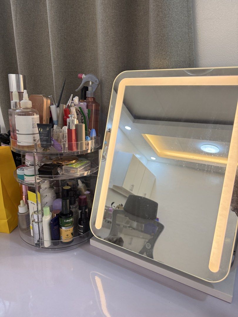 LED Lighted Makeup Vanity Mirror with Stand (Category: Mirrors) located in Manila. Submitted by k.e9999 (Listing ID 1471259149, Image 1). Description: - Color: White tabletop design - Features: Built-in LED lighting around the frame with touch sensor power button - Function: Adjustable angle stand that rotates vertically - Condition: Fully working, bright lights, and clean glass surface with minimal dust - Stability: Sturdy base for secure placem