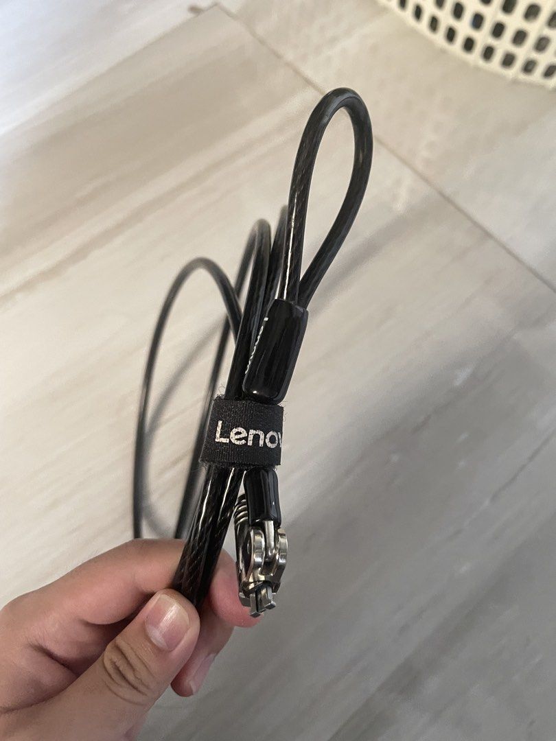 Lenovo Laptop Security Cable Lock with Keys (Category: Laptops & Notebooks) located in Manila. Submitted by young_arvss (Listing ID 1471134791, Image 3). Description: - Genuine Lenovo security cable lock for laptops and notebooks - Ideal for securing your device in offices, coffee shops, or public spaces - Durable long steel cable wrapped in protective black plastic - Standard T-bar lock mechanism fits security slots securely - Convenient loop en