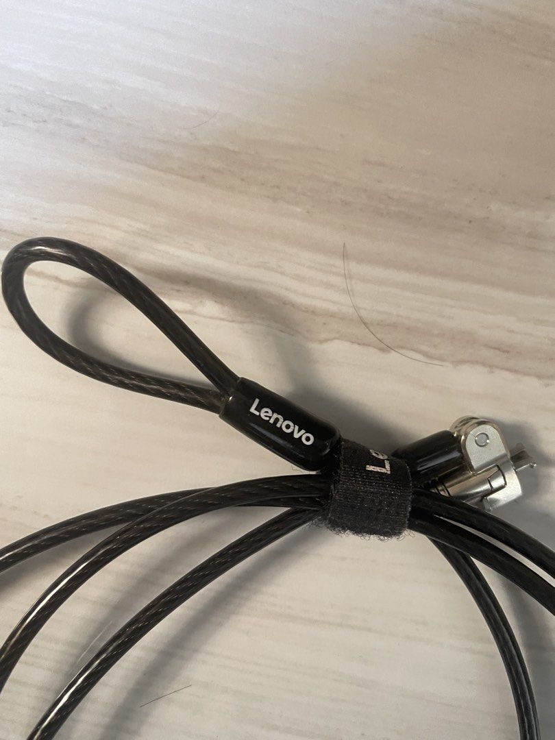 Lenovo Laptop Security Cable Lock with Keys (Category: Laptops & Notebooks) located in Manila. Submitted by young_arvss (Listing ID 1471134791, Image 2). Description: - Genuine Lenovo security cable lock for laptops and notebooks - Ideal for securing your device in offices, coffee shops, or public spaces - Durable long steel cable wrapped in protective black plastic - Standard T-bar lock mechanism fits security slots securely - Convenient loop en