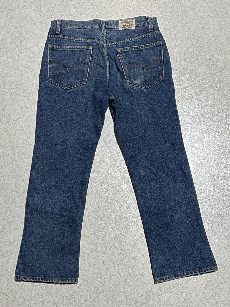 Levi Strauss & Co Blue Denim Jeans (Category: Jeans) located in Manila. Submitted by channyy_22 (Listing ID 1471270230, Image 3). Description: - Brand: Levi Strauss & Co. - Wash: Medium blue - Fit: Classic straight leg - Material: Sturdy, durable cotton denim - Features: Traditional five-pocket styling, zip fly, contrast golden stitching - Details: Iconic rear leather waist patch and signature red tab.