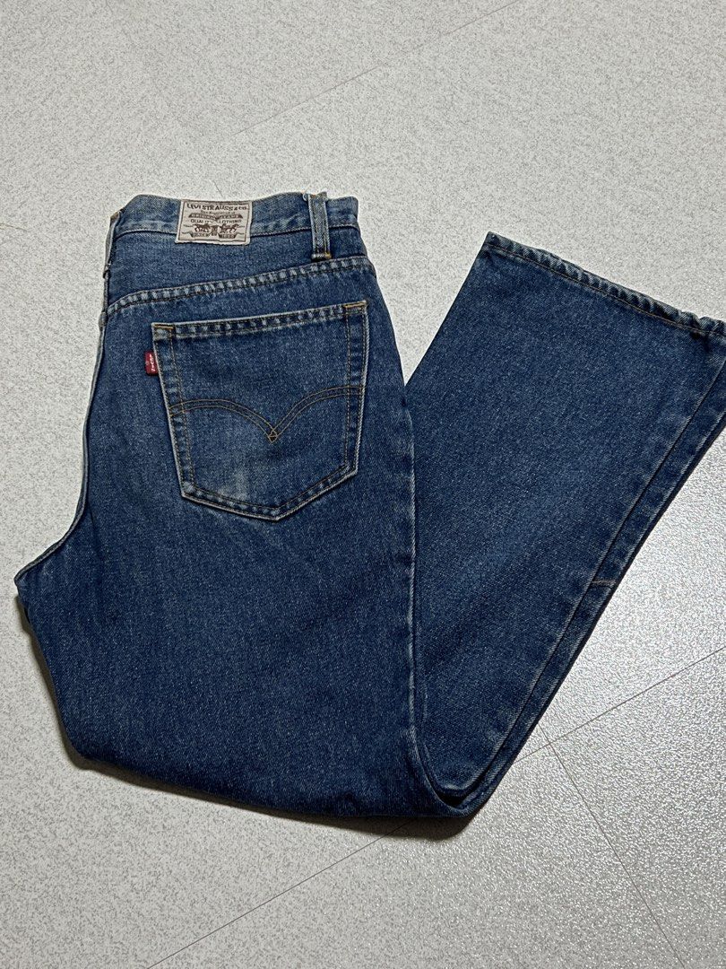 Levi Strauss & Co Blue Denim Jeans (Category: Jeans) located in Manila. Submitted by channyy_22 (Listing ID 1471270230, Image 2). Description: - Brand: Levi Strauss & Co. - Wash: Medium blue - Fit: Classic straight leg - Material: Sturdy, durable cotton denim - Features: Traditional five-pocket styling, zip fly, contrast golden stitching - Details: Iconic rear leather waist patch and signature red tab.