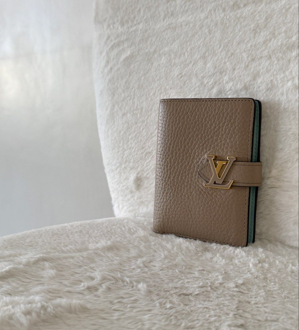 Louis Vuitton Capucine Compact Wallet (Category: Luxury Bags & Wallets) located in Quezon City. Submitted by closet24 (Listing ID 1471295973, Image 1). Description: - Taurillon Leather - Galet Gray (exterior) / Aquamarine blue -Gold hardware -6 card slots -Zipped coin pocket Retails for 60k++ on website 8.9/10 Very minimal signs of use Inclusions Box, dust bag, gift card Slightly nego posted it low.
