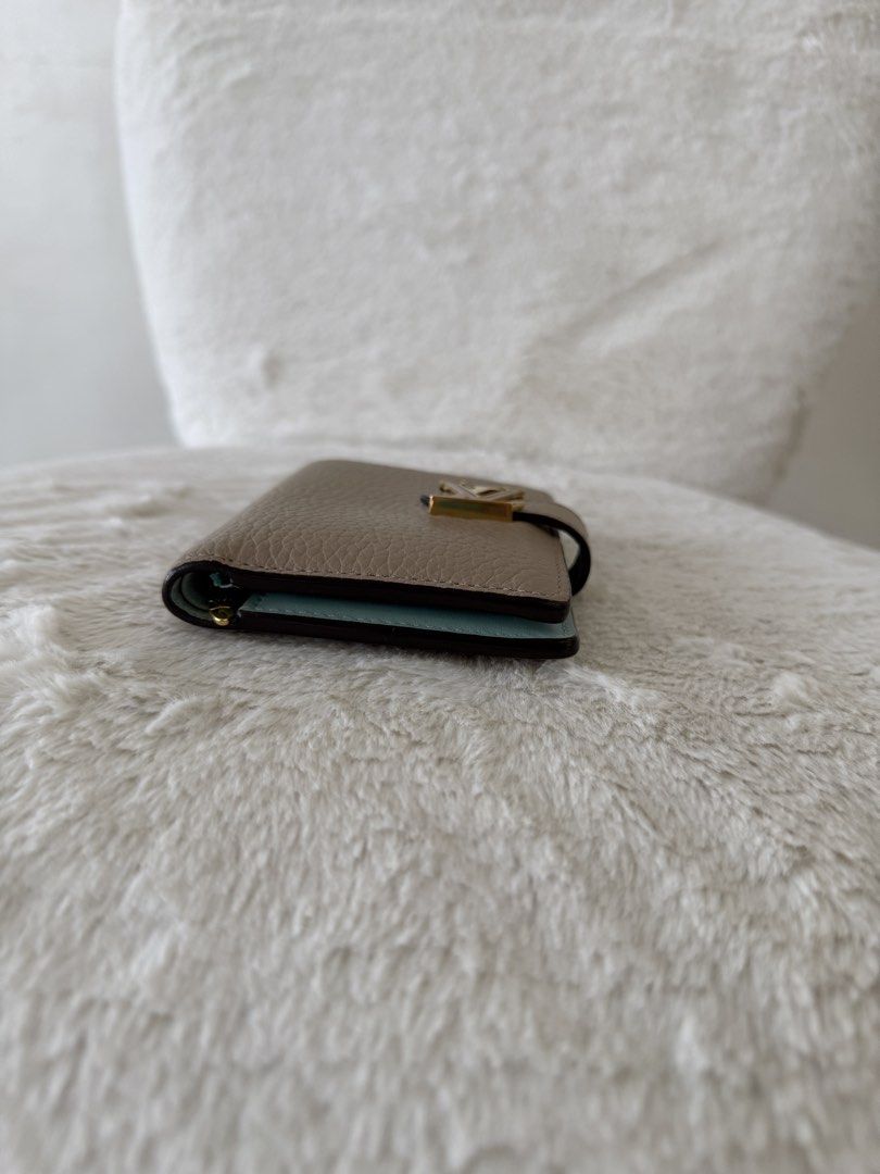 Louis Vuitton Capucine Compact Wallet (Category: Luxury Bags & Wallets) located in Quezon City. Submitted by closet24 (Listing ID 1471295973, Image 3). Description: - Taurillon Leather - Galet Gray (exterior) / Aquamarine blue -Gold hardware -6 card slots -Zipped coin pocket Retails for 60k++ on website 8.9/10 Very minimal signs of use Inclusions Box, dust bag, gift card Slightly nego posted it low.