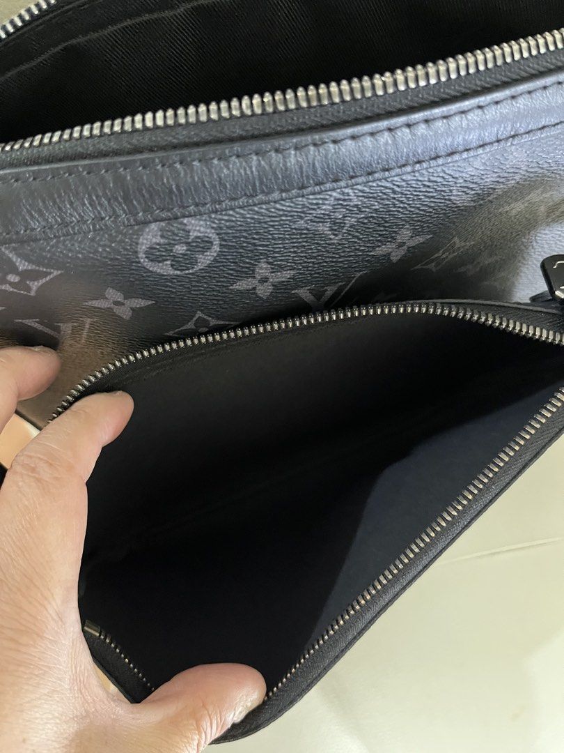 Louis Vuitton Monogram Eclipse M69443 Trio Messenger Bag (Category: Luxury Bags & Wallets) located in Manila. Submitted by summerjes0609 (Listing ID 1471167227, Image 3). Description: Authentic Louis Vuitton messenger bag in Monogram Eclipse canvas. Features a sleek dark grey and black design with silver hardware, multiple zip compartments, and a handy removable pouch on the adjustable strap. Perfect for daily use. Very good condition.