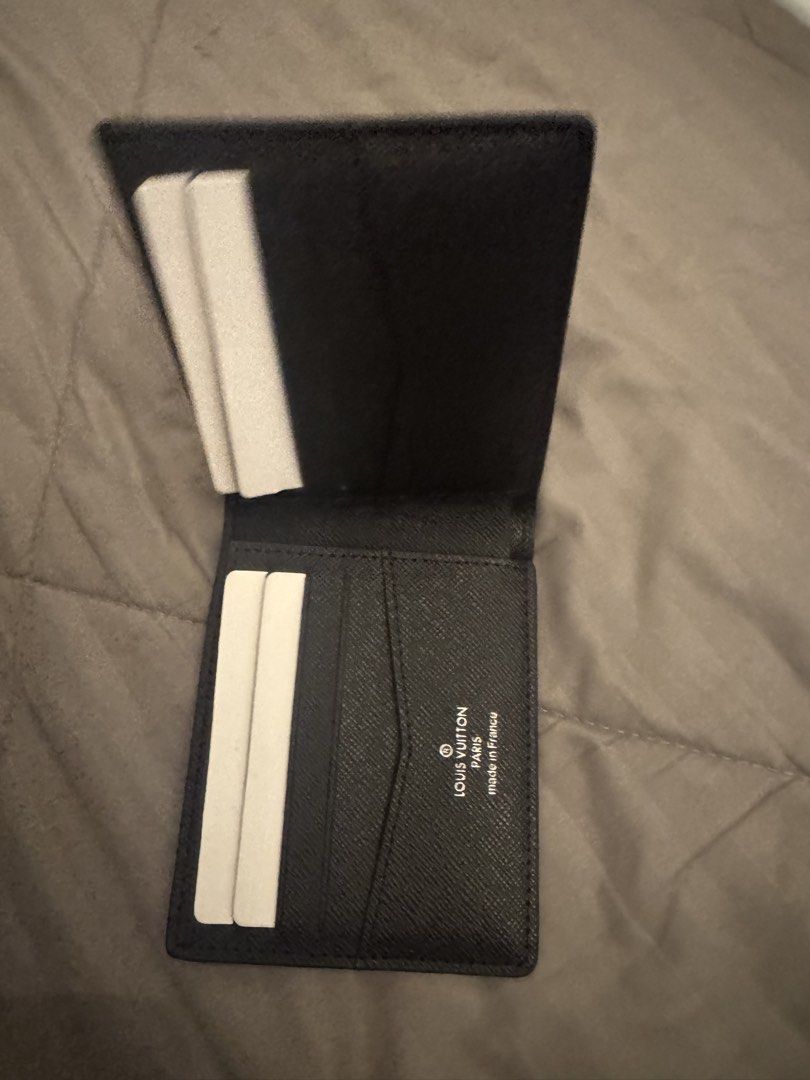 Louis Vuitton Monogram Eclipse Multiple Wallet (Category: Wallets & Card Holders) located in Kuala Lumpur. Submitted by syncronixed (Listing ID 1471256969, Image 2). Description: - Brand: Louis Vuitton - Model: Multiple Wallet - Material: Monogram Eclipse canvas - Color: Dark grey and black - Condition: Brand new with protective foam inserts intact - Design: Compact bi-fold with multiple card slots and compartments - Interior: Clean black lining 