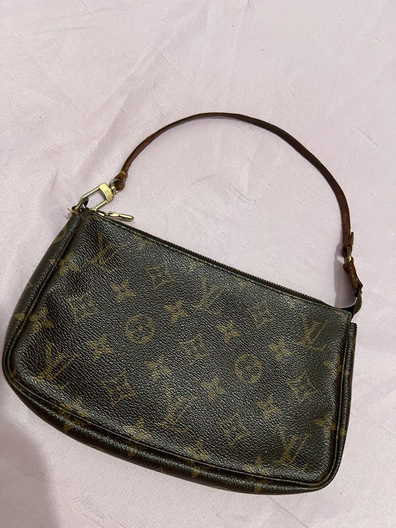 Louis Vuitton Monogram Pochette Accessories Handbag (Category: Luxury Bags & Wallets) located in Manila. Submitted by czaaay (Listing ID 1471124748, Image 1). Description: - Authentic Louis Vuitton monogram canvas pochette - Classic brown leather strap with a lovely vintage patina - Elegant gold-tone hardware - Secure zipper closure across the top - Compact size, ideal for carrying small daily essentials - Condition: Vintage, well-loved.