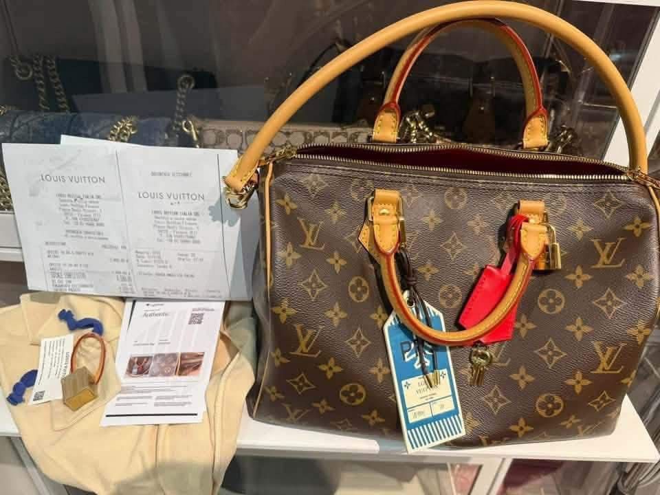 Louis Vuitton Speedy Soft 30 Crafty M11945 Monogram (Category: Luxury Bags & Wallets) located in Cebu City. Submitted by forless.ph (Listing ID 1471242244, Image 3). Description: - Model: Louis Vuitton Speedy Soft 30 Crafty - Material: Monogram coated canvas with ultra-soft feel and striking red leather lining - Included Accessories: Top handles, adjustable shoulder strap, padlock, keys, and luggage tag - Packaging & Proof of Authenticity: Dust b