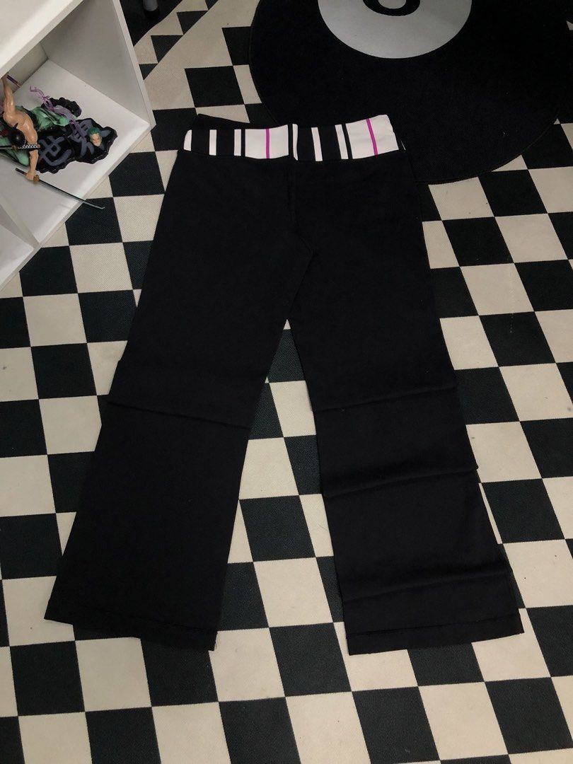Lululemon Black Flare Pants Dimes: 30X32 (Category: Jeans) located in Manila. Submitted by ejaay_2012 (Listing ID 1471153857, Image 1). Description: - Brand: Lululemon - Style: Classic flare yoga pants - Color: Black with a reversible foldover waistband (Striped white, black, and hot pink / Solid hot pink) - Details: Signature white Lululemon logo near the hip - Condition: Pre-loved with minor pilling near the crotch seam and a couple of small fa