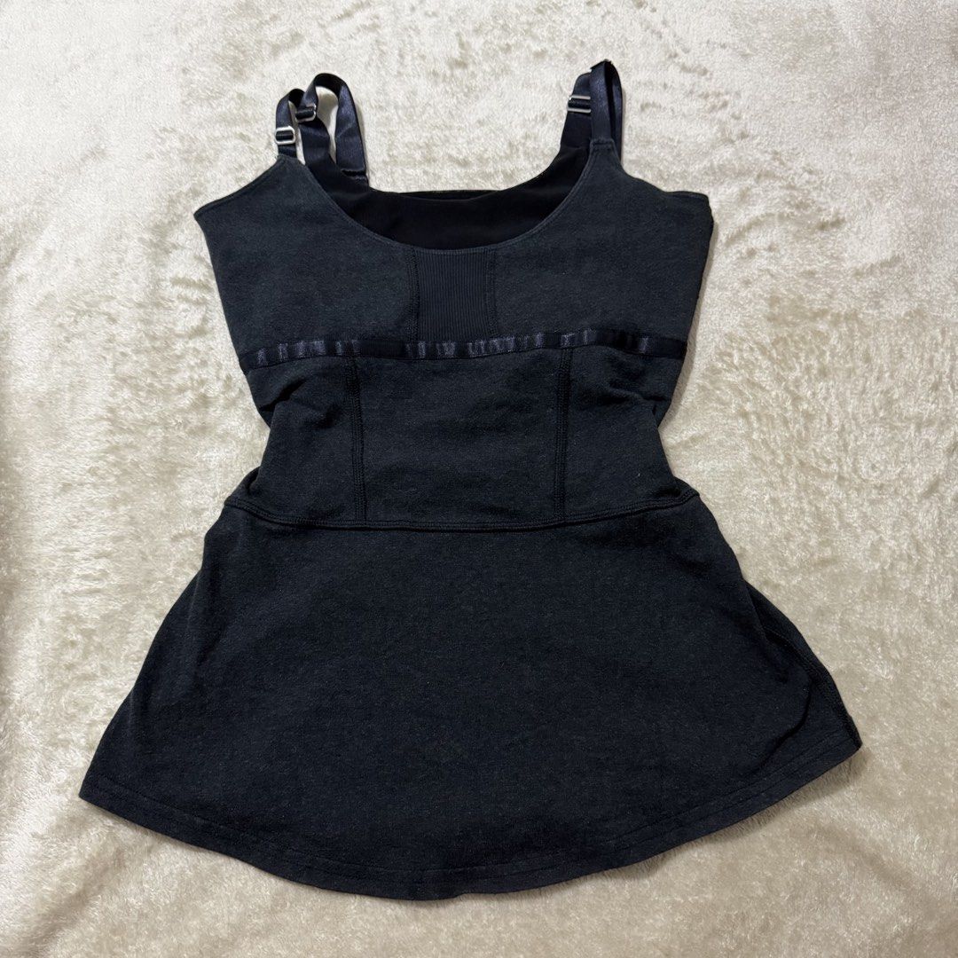 Lululemon Black Strappy Longline Tank Top with Padding – dot 4 (Category: Activewear) located in Pasay City. Submitted by bellita_05 (Listing ID 1471247849, Image 3). Description: Classic Lululemon longline tank top in black, featuring a flattering fitted waist, flared hem and delicate strappy back. • Brand: Lululemon • Size: 4 (based on size dot) • Colour: Charcoal grey • Strappy adjustable shoulder straps • Padded cups • Flared A-line silhouett
