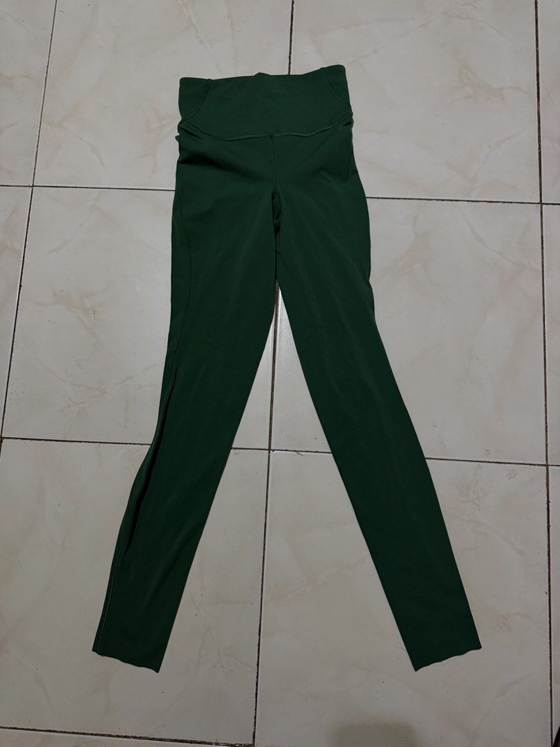 Lululemon Green Leggings Size 2 (Category: Activewear) located in Davao. Submitted by nobleangel (Listing ID 1471137444, Image 1). Description: - Brand: Lululemon - Color: Dark Green - Size: 2 (tag inside waistband) - Fit: High-rise with small waistband pocket - Details: Classic Lulu logo on back leg - Fabric: Soft and stretchy, perfect for workouts or daily wear.