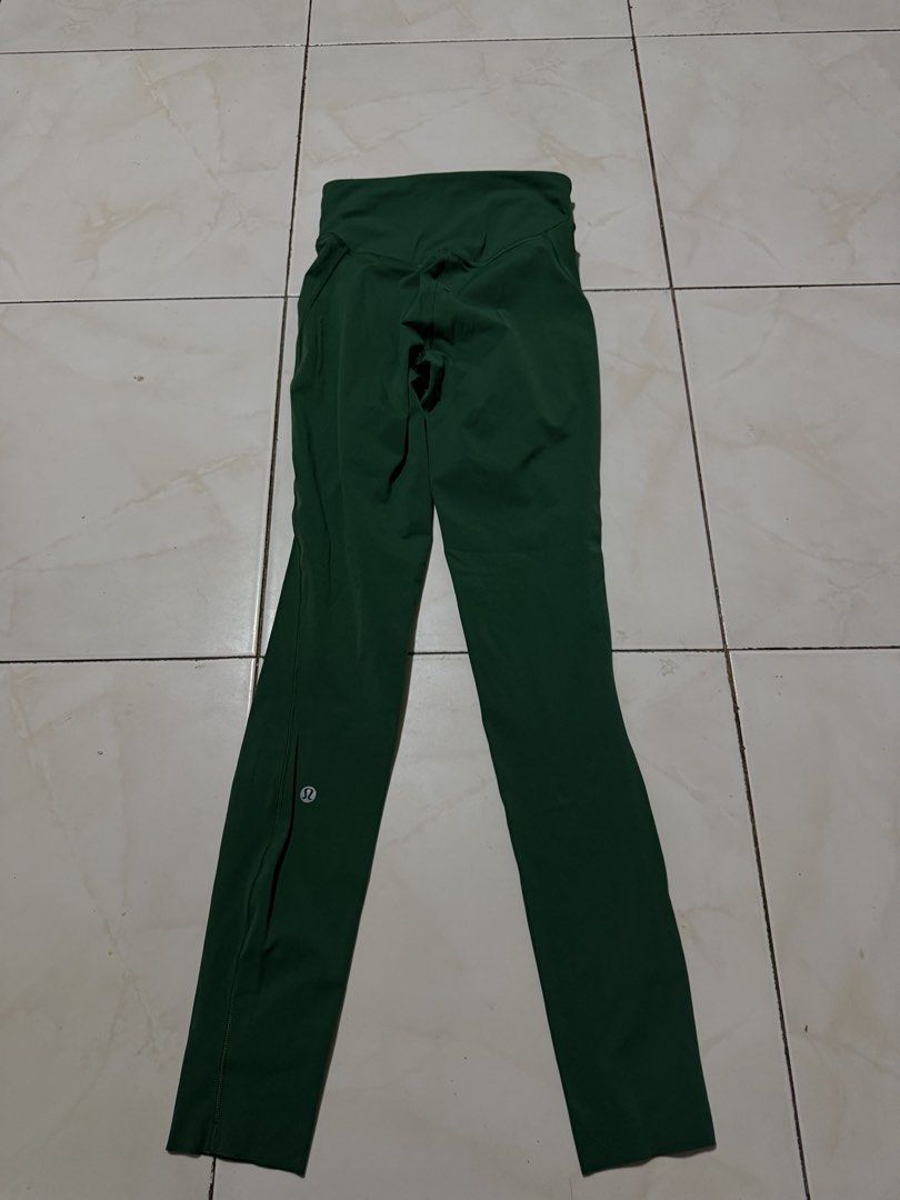 Lululemon Green Leggings Size 2 (Category: Activewear) located in Davao. Submitted by nobleangel (Listing ID 1471137444, Image 2). Description: - Brand: Lululemon - Color: Dark Green - Size: 2 (tag inside waistband) - Fit: High-rise with small waistband pocket - Details: Classic Lulu logo on back leg - Fabric: Soft and stretchy, perfect for workouts or daily wear.
