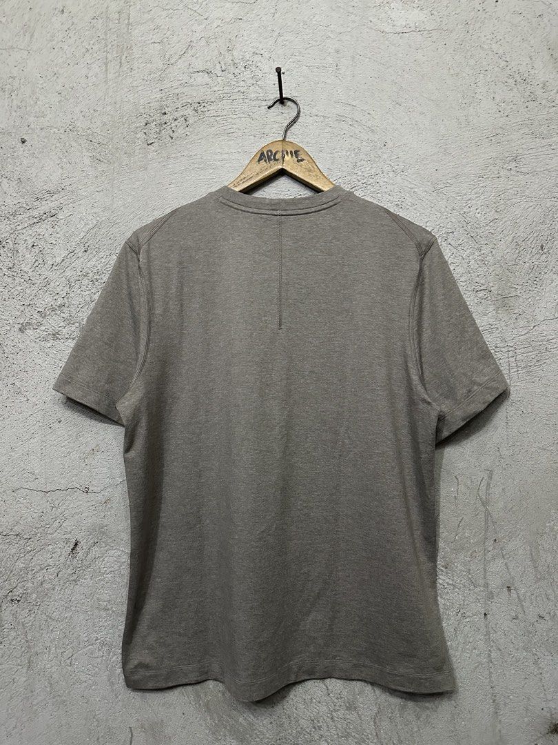 Lululemon Men's Grey Athletic T-Shirt (Category: Tshirts & Polo Shirts ) located in Quezon City. Submitted by stre3tw3ar (Listing ID 1471273313, Image 2). Description: - Brand: Lululemon - Style: Men's short sleeve athletic t-shirt - Color: Grey marl - Details: Round neckline, signature logo printed near the sleeve hem - Material: Breathable athletic fabric - Condition: Clean overall, great for gym or everyday wear.