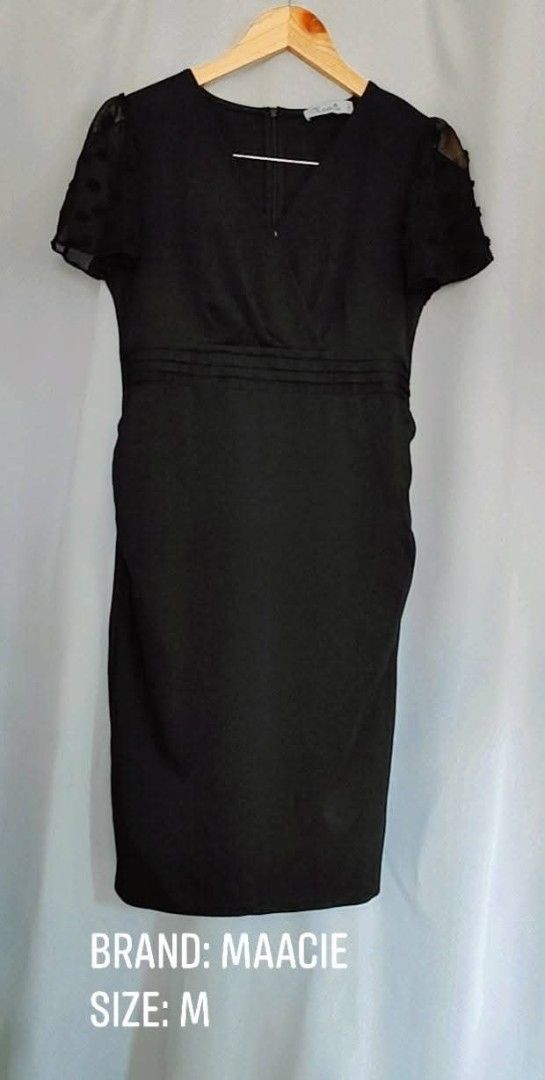 Maacie Black Dress Size M (Category: Dresses) located in Bacoor. Submitted by stargazer1084 (Listing ID 1471275245, Image 1). Description: - Brand: Maacie - Size: M - Color: Classic Black - Design: V-neckline with a stylish pleated waist - Sleeves: Short sheer sleeves with a cute dotted pattern - Versatility: Ideal for professional office wear or evening events - Condition: Clean, well-maintained.