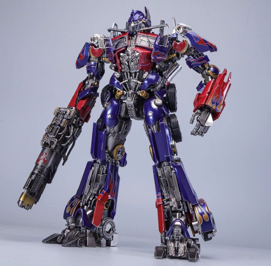 MAGNIFICENT MECHA MM-02B Transformers Optimus Prime DOTM (Category: Vehicle & Diecast Models) located in Manila. Submitted by mauchan00000303 (Listing ID 1471178677, Image 3). Description: - Transformable Optimus Prime action figure - Converts smoothly between robot and semi-truck mode - Premium metallic paint finish with iconic flame graphics - Fully articulated joints for dynamic and poseable displays - Comes with interchangeable weapons: blast
