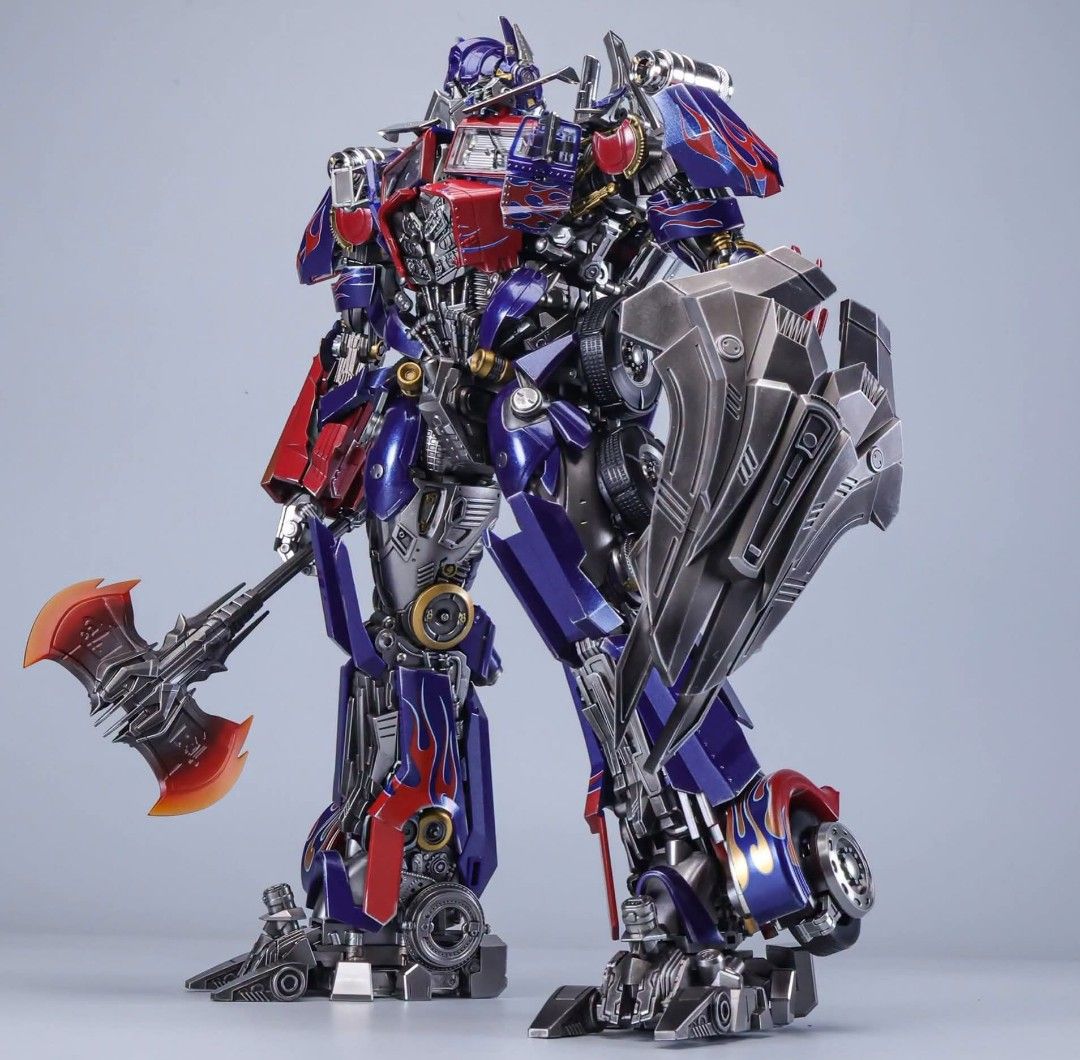 MAGNIFICENT MECHA MM-02B Transformers Optimus Prime DOTM (Category: Vehicle & Diecast Models) located in Manila. Submitted by mauchan00000303 (Listing ID 1471178677, Image 2). Description: - Transformable Optimus Prime action figure - Converts smoothly between robot and semi-truck mode - Premium metallic paint finish with iconic flame graphics - Fully articulated joints for dynamic and poseable displays - Comes with interchangeable weapons: blast