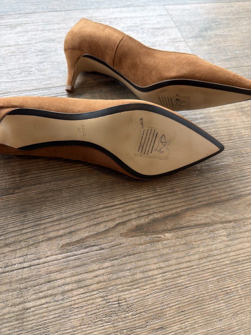 Mango Brown Suede Pointed-Toe Kitten Heels Size 37 (Category: Heels) located in Manila. Submitted by evegalvez (Listing ID 1471168620, Image 3). Description: - Brand: Mango - Type: Brown suede pumps - Size: 37 - Features: Pointed toe and comfortable kitten heel - Condition: Brand new, never worn outdoors, protective plastic film still on soles - Color: Neutral cognac, great for both office and casual outfits.