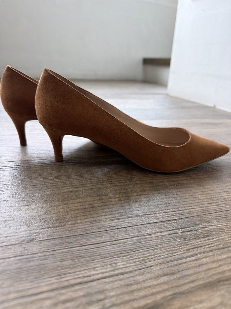 Mango Brown Suede Pointed-Toe Kitten Heels Size 37 (Category: Heels) located in Manila. Submitted by evegalvez (Listing ID 1471168620, Image 2). Description: - Brand: Mango - Type: Brown suede pumps - Size: 37 - Features: Pointed toe and comfortable kitten heel - Condition: Brand new, never worn outdoors, protective plastic film still on soles - Color: Neutral cognac, great for both office and casual outfits.
