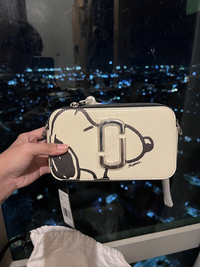 Marc Jacobs Snoopy Snapshot Camera Bag Cotton Multi (Category: Other Accessories) located in Imus. Submitted by ann__xoxo (Listing ID 1471179061, Image 3). Description: - Brand: Marc Jacobs - Style: Snapshot Bag (Cotton Multi with Snoopy Graphics) - Hardware: Silver - Features: Dual zip compartments, webbed strap (still wrapped in original plastic) - Inclusions: Dust bag and original tags attached - Condition: Brand new, never used, straight out 