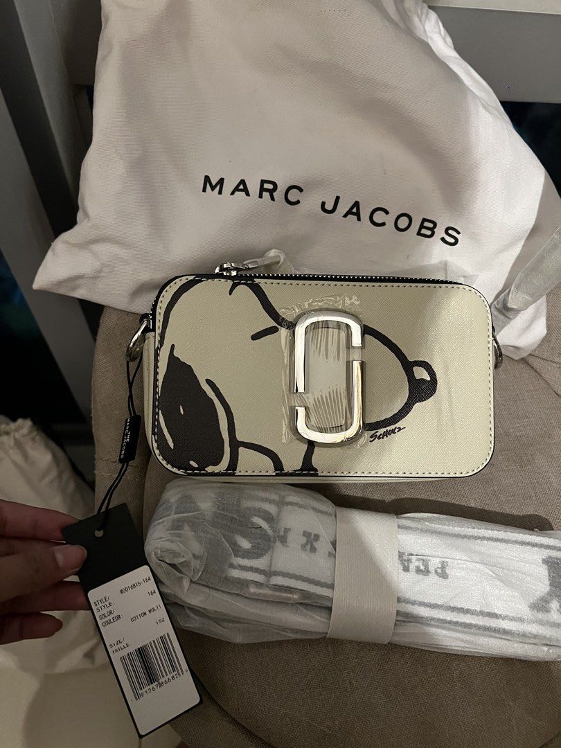 Marc Jacobs Snoopy Snapshot Camera Bag Cotton Multi (Category: Other Accessories) located in Imus. Submitted by ann__xoxo (Listing ID 1471179061, Image 1). Description: - Brand: Marc Jacobs - Style: Snapshot Bag (Cotton Multi with Snoopy Graphics) - Hardware: Silver - Features: Dual zip compartments, webbed strap (still wrapped in original plastic) - Inclusions: Dust bag and original tags attached - Condition: Brand new, never used, straight out 