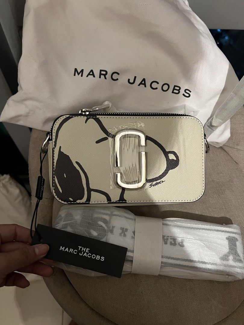 Marc Jacobs Snoopy Snapshot Camera Bag Cotton Multi (Category: Other Accessories) located in Imus. Submitted by ann__xoxo (Listing ID 1471179061, Image 2). Description: - Brand: Marc Jacobs - Style: Snapshot Bag (Cotton Multi with Snoopy Graphics) - Hardware: Silver - Features: Dual zip compartments, webbed strap (still wrapped in original plastic) - Inclusions: Dust bag and original tags attached - Condition: Brand new, never used, straight out 