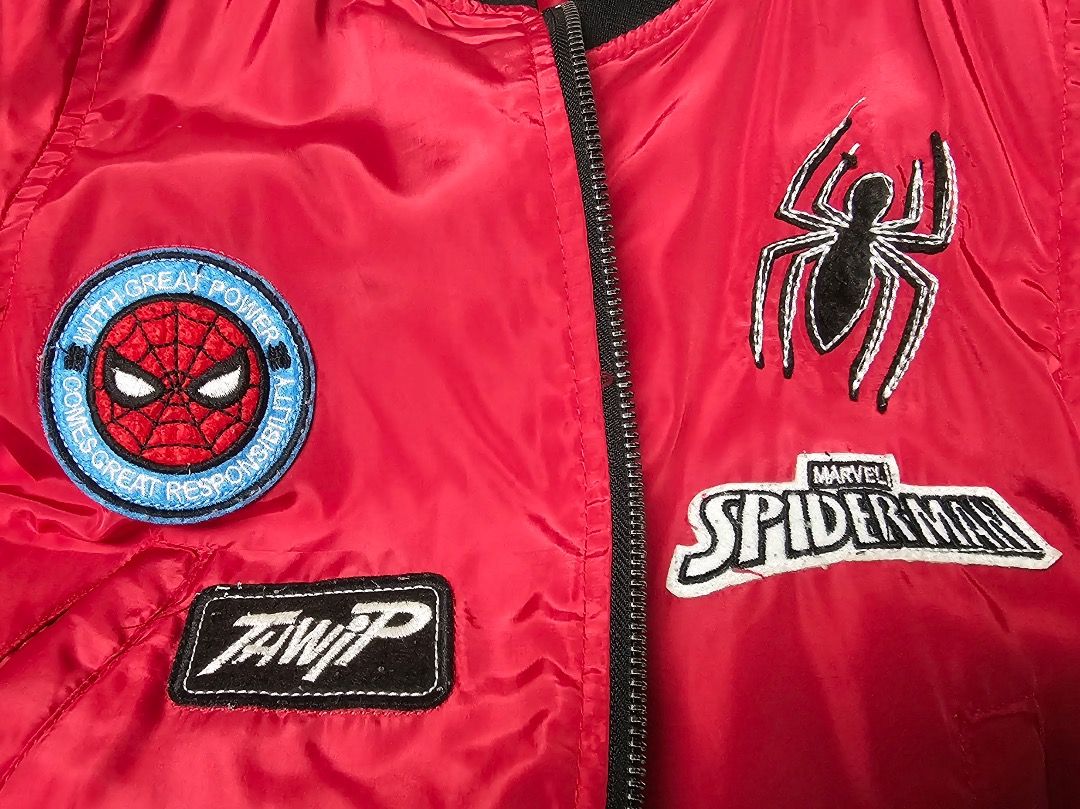 Marvel Spider-Man Kids Bomber Varsity Jacket (Category: Babies & Kids Fashion) located in Cabanatuan. Submitted by aralets (Listing ID 1471290334, Image 2). Description: Pre-loved Marvel Spider-Man kids' jacket. Bomber or varsity style. Standard thrift find. Fits children. Character graphics on the fabric. Casual outerwear piece for young fans. Grab it now for everyday wear. Style and Color: Bright red bomber-style jacket with a black ribbed coll