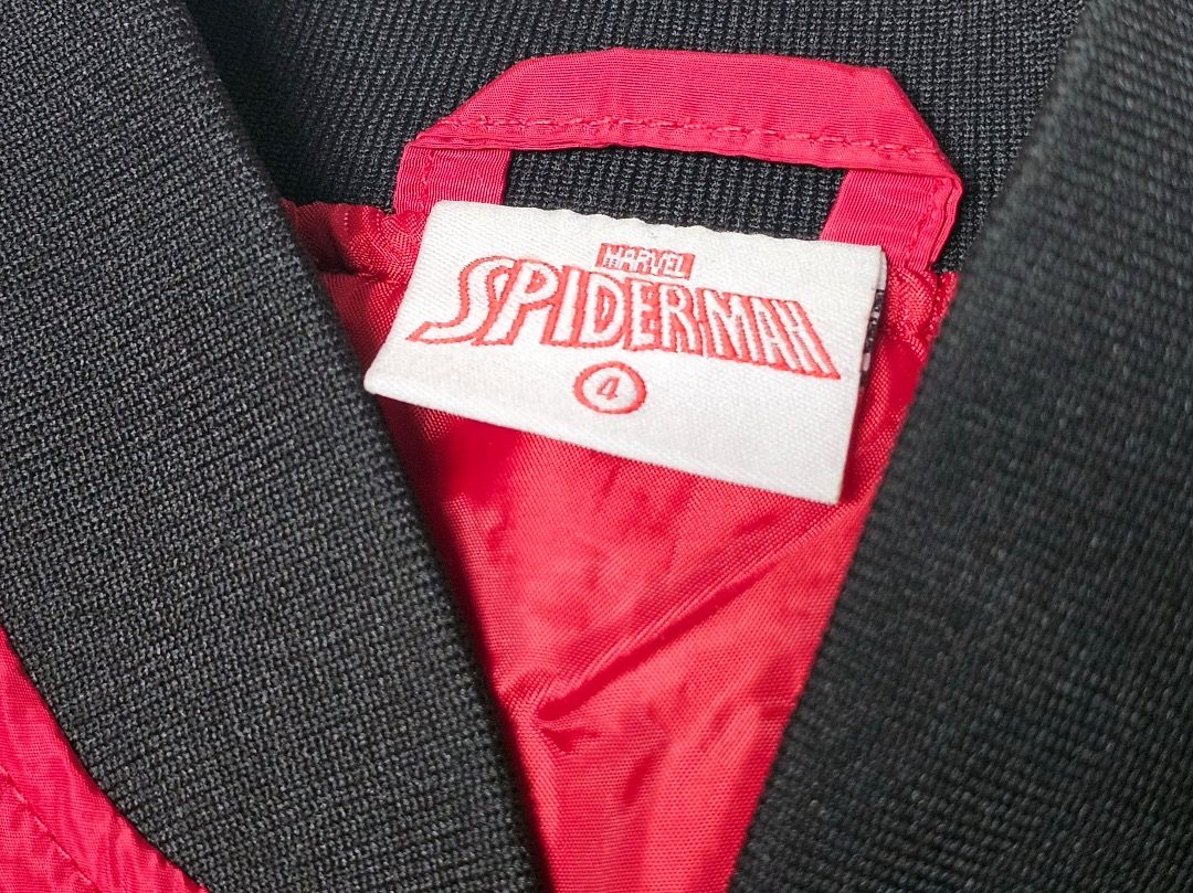 Marvel Spider-Man Kids Bomber Varsity Jacket (Category: Babies & Kids Fashion) located in Cabanatuan. Submitted by aralets (Listing ID 1471290334, Image 3). Description: Pre-loved Marvel Spider-Man kids' jacket. Bomber or varsity style. Standard thrift find. Fits children. Character graphics on the fabric. Casual outerwear piece for young fans. Grab it now for everyday wear. Style and Color: Bright red bomber-style jacket with a black ribbed coll