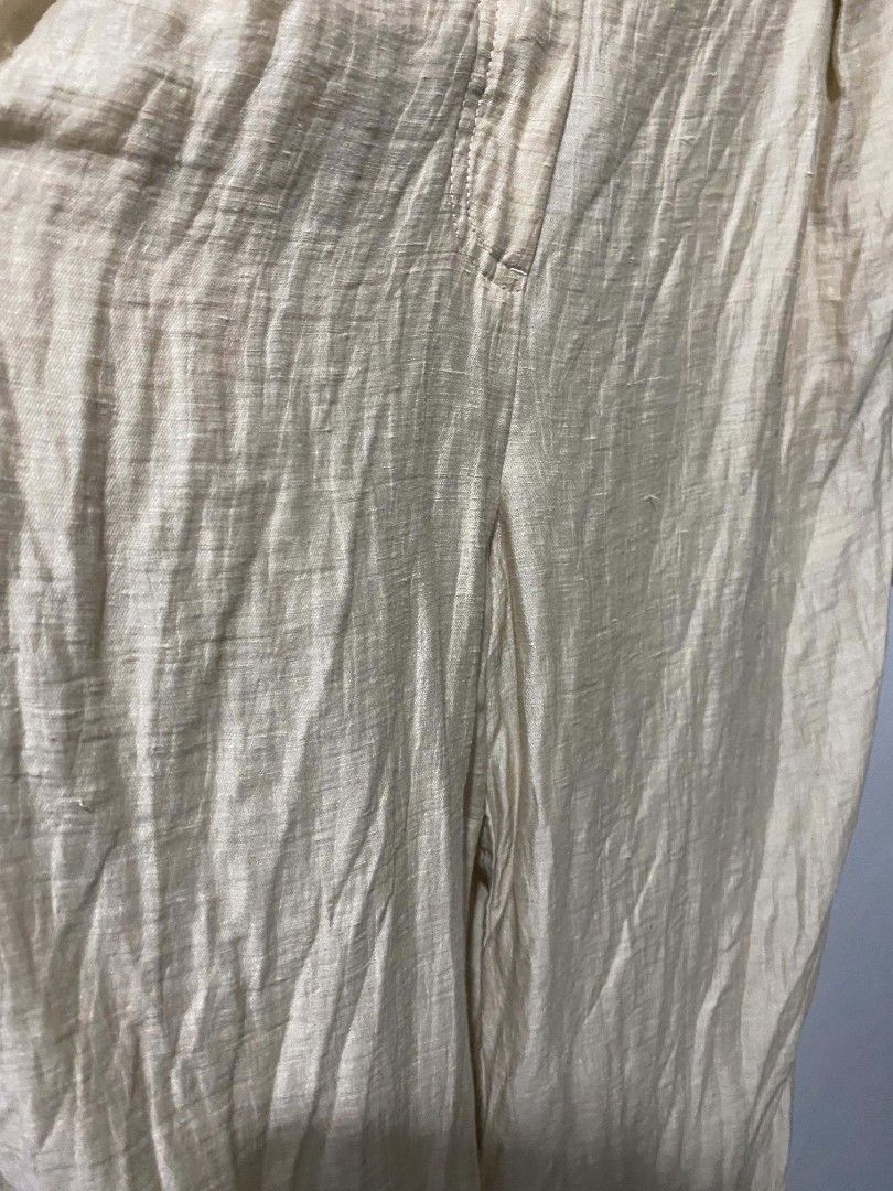 Massimo Dutti wide-leg cuffed trousers (Category: Trousers) located in Iba. Submitted by yunqiz (Listing ID 1471278488, Image 3). Description: Outer Shell: 87% Linen, 13% Polyamide (Nylon) — providing a lightweight, breathable linen texture with added durability and wrinkle resistance. Lining: 51% Acetate, 49% Viscose. Design Details: High-waisted silhouette with front pleats, hidden zip fly with hook-and-eye closure, side pockets, rear welt pock