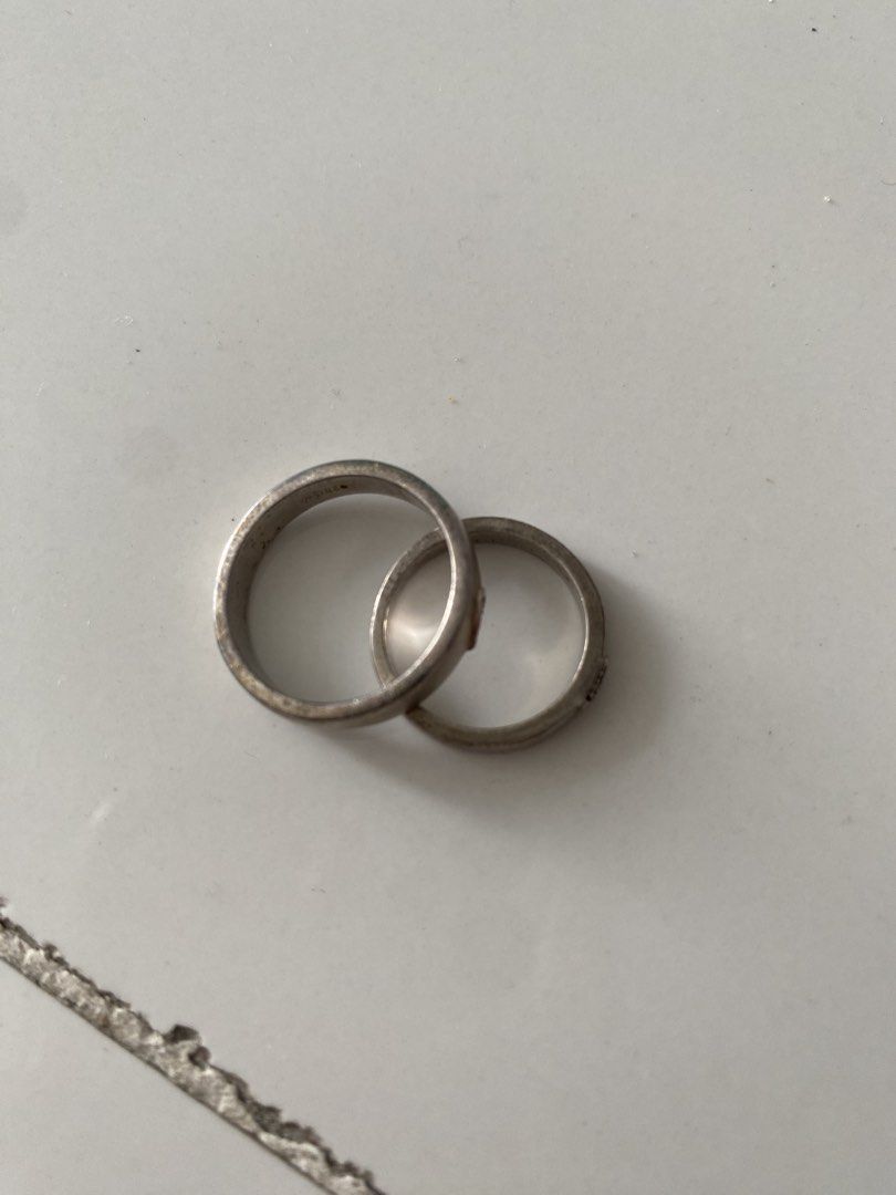 Matching Couple Heart Crystal Silver Rings Set (Category: Rings) located in Bulacan. Submitted by prelovedbyjgs (Listing ID 1471199984, Image 3). Description: - Matching silver couple rings featuring cute heart cutouts with tiny crystals - One band is slightly thicker for a comfortable fit for him/her - Pre-owned condition with minor signs of wear and light tarnish spots - Can easily be polished and brightened up with silver cleaner - Perfect aff