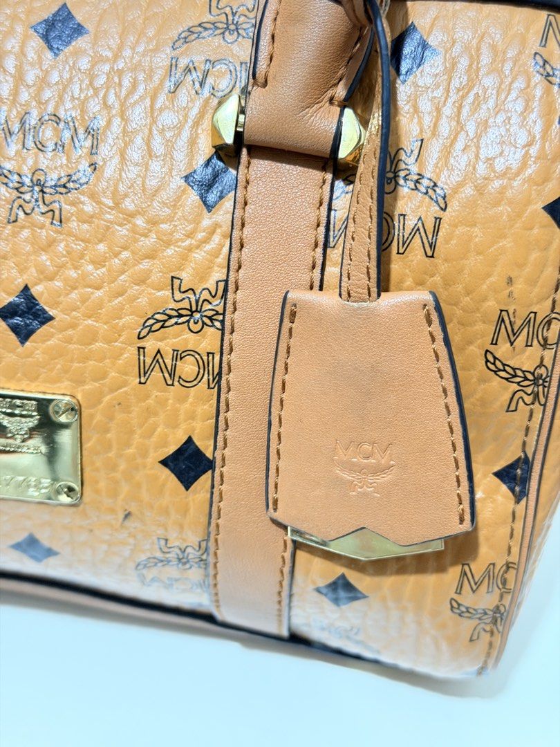 MCM Cognac Visetos Boston Bag (Category: Luxury Bags & Wallets) located in Paranaque City. Submitted by diannmlee (Listing ID 1471207170, Image 2). Description: Needs cleaning Sign of usage No sling I bought this sa Tiktok live selling ng ukay bags and never used it. Impulse buy lang. It looks and feels legit. I am not 💯 sure though. Bag condition: 7.5/10.