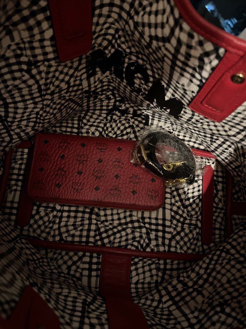 MCM Red Leather Monogram Zip Around Wallet (Category: Activewear) located in Imus. Submitted by ann__xoxo (Listing ID 1471180442, Image 3). Description: - Brand: MCM - Material: Premium red leather with classic all-over monogram print - Closure: Zip-around to keep cash and cards secure - Hardware: Elegant gold-tone zippers - Interior: Stylish red and black gingham lining - Condition: Clean exterior, well-maintained.