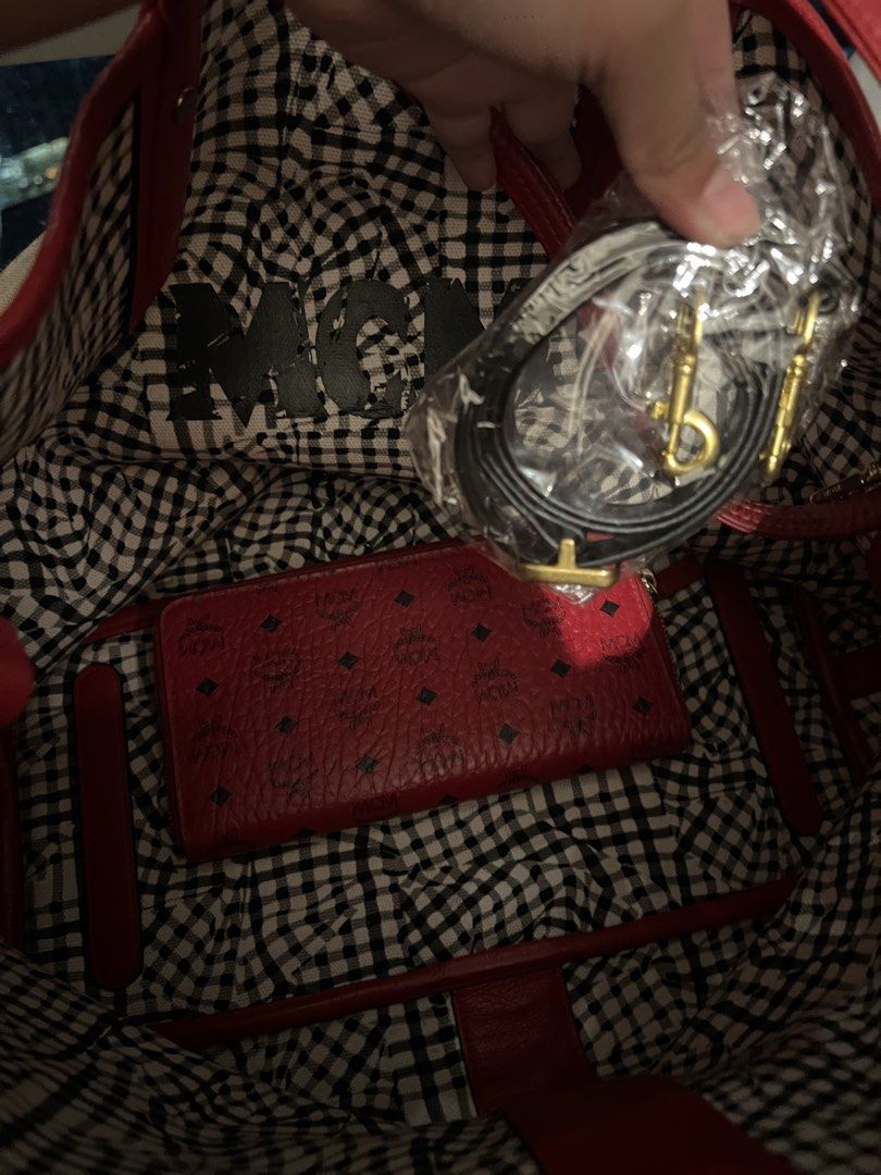 MCM Red Leather Monogram Zip Around Wallet (Category: Activewear) located in Imus. Submitted by ann__xoxo (Listing ID 1471180442, Image 2). Description: - Brand: MCM - Material: Premium red leather with classic all-over monogram print - Closure: Zip-around to keep cash and cards secure - Hardware: Elegant gold-tone zippers - Interior: Stylish red and black gingham lining - Condition: Clean exterior, well-maintained.