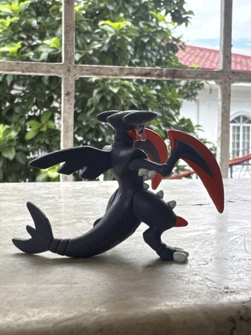 Mega Garchomp Pokémon Tomy Figure (Category: Figurines & Statues) located in Quezon City. Submitted by JDC_Onlineshop (Listing ID 1471145171, Image 3). Description: - Official Tomy Mega Garchomp figure - Detailed dark grey body with iconic red scythe arms and spiky accents - Stamped with authentic Pokémon and Tomy logos on the tail - Stands securely and independently on its feet and tail - Clean paint job with well-maintained details - Ideal for 